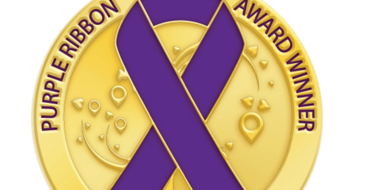 golden award medallion with purple ribbon, logo of the Purple Ribbon Awards